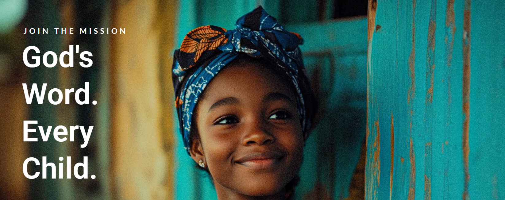 A child smiling, representing the Sword of the Spirit reading mission